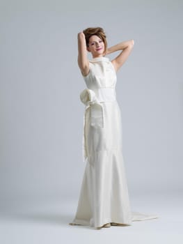 Portrait of beautiful young women in wedding dress isolated on a white background