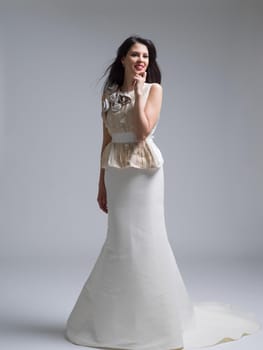 Portrait of beautiful young women in wedding dress isolated on a white background