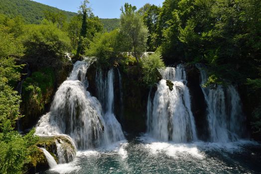 waterfall with clean and fresh water  nature with green forest in background