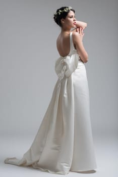 Portrait of beautiful young women in wedding dress isolated on a white background