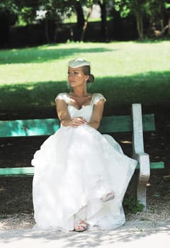 beautiful bride woman people in fashion wedding dress posing outdoor in bright park