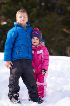 Brother and sister portrait in winter time