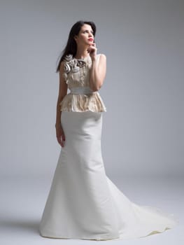 Portrait of beautiful young women in wedding dress isolated on a white background