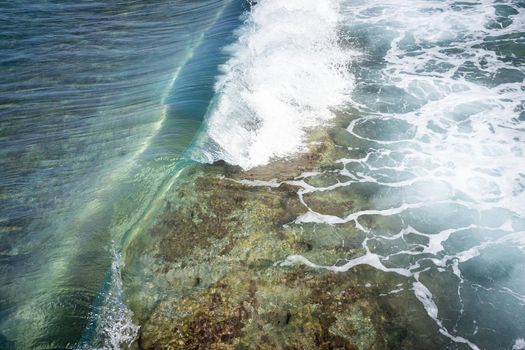 Sea water makin beautiful waves under sun