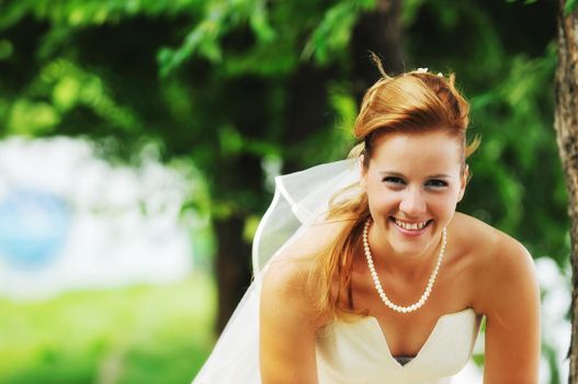 happy young and beautiful bride and groom at wedding party  outdoor