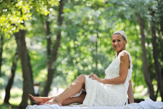 beautiful bride woman people in fashion wedding dress posing outdoor in bright park