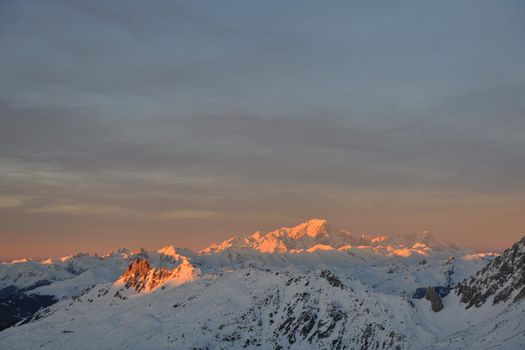 mountain snow fresh sunset at ski resort in france val thorens 