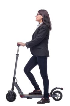 Side view of woman enjoying riding with electric scooter on white background. Concept of healthy lifestyle