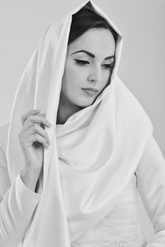 beautiful young bride wearing  wedding dress in retro fashion style isolated on white background in studio