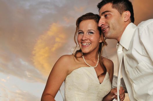 happy young and beautiful bride and groom at wedding party  outdoor