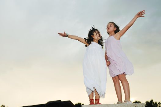 happy two girls outdoor in cute dress fashion clothing 