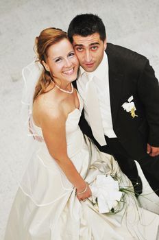 happy young and beautiful bride and groom at wedding party  outdoor