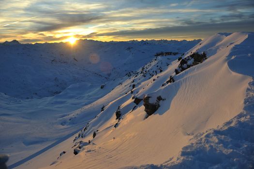 mountain snow ski with beautiful sunset in background 