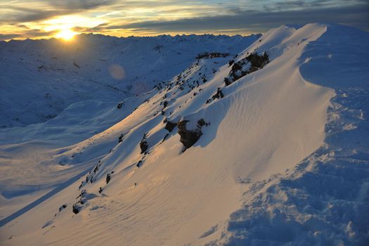 mountain snow fresh sunset at ski resort in france val thorens 