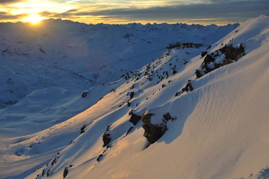 mountain snow fresh sunset at ski resort in france val thorens 