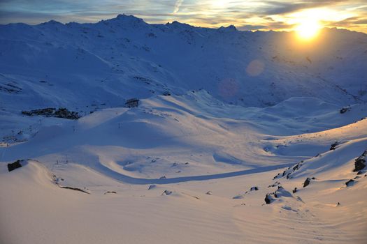 mountain snow fresh sunset at ski resort in france val thorens 