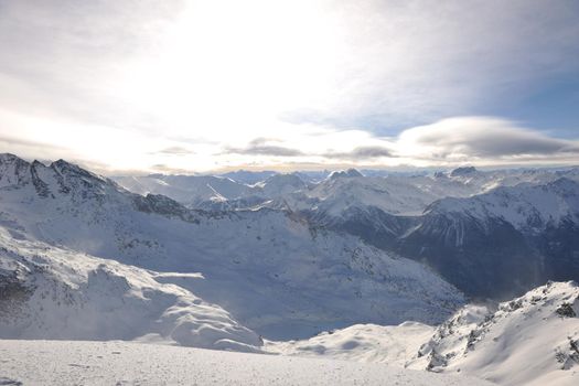 mountain snow fresh sunset at ski resort in france val thorens 