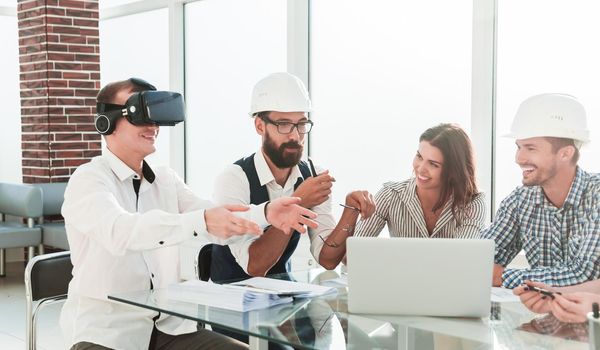 young designer uses virtual reality glasses at a meeting in the office.people and technology