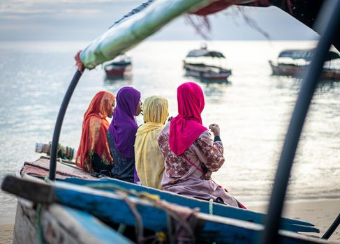 Group of Muslim girls together on the beach