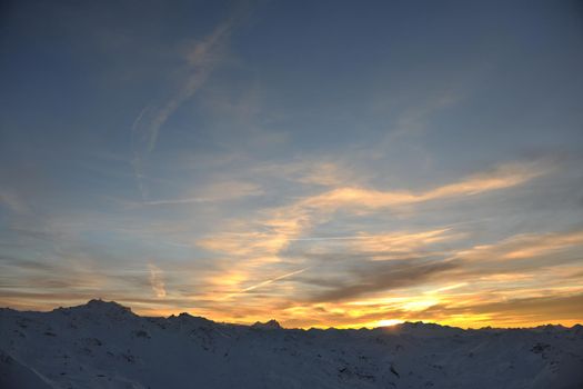 mountain snow fresh sunset at ski resort in france val thorens 