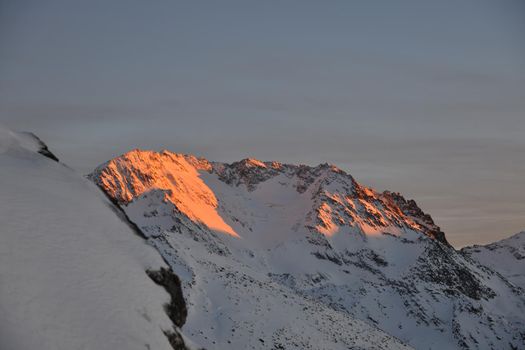 mountain snow fresh sunset at ski resort in france val thorens 