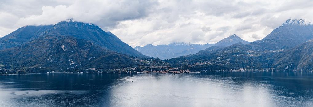 Panorama of the town of Menaggio at the foot of the Alpine mountains. Lake Como, Italy. High quality photo
