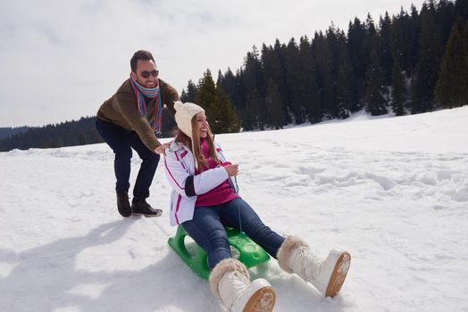 romantic winter  scene, happy young couple having fun on fresh show on winter vacatio, mountain nature landscape