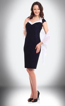 in full growth. charming young businesswoman in a black dress