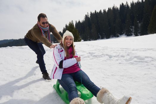romantic winter  scene, happy young couple having fun on fresh show on winter vacatio, mountain nature landscape