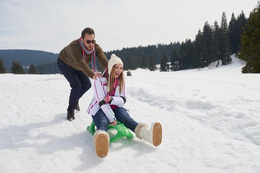 romantic winter  scene, happy young couple having fun on fresh show on winter vacatio, mountain nature landscape