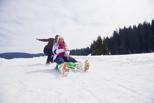 romantic winter  scene, happy young couple having fun on fresh show on winter vacatio, mountain nature landscape