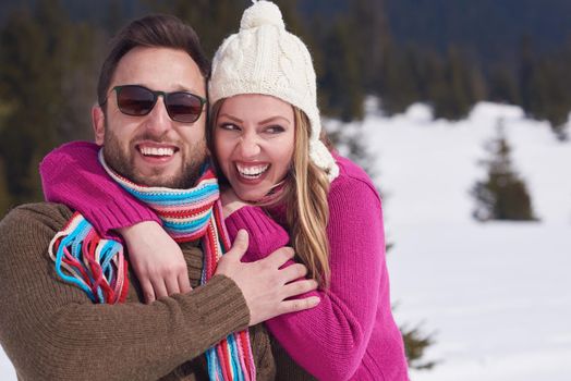 portrait of happy young romantic tourist  couple outdoor in nature at winter vacation