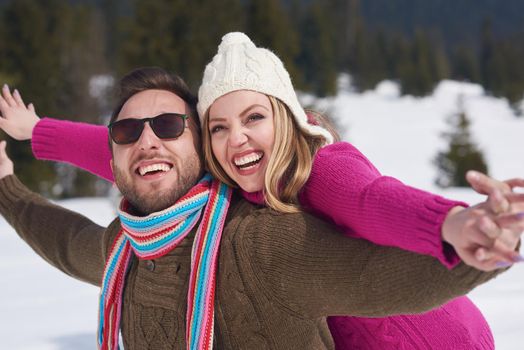 portrait of happy young romantic tourist  couple outdoor in nature at winter vacation