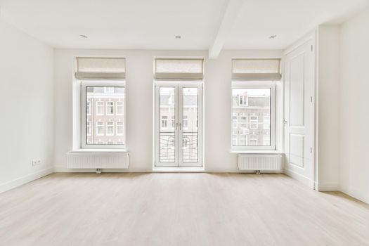 Interior of a bright room with large windows