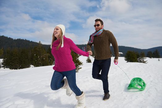 romantic winter  scene, happy young couple having fun on fresh show on winter vacatio, mountain nature landscape