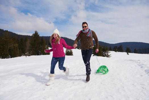 romantic winter  scene, happy young couple having fun on fresh show on winter vacatio, mountain nature landscape