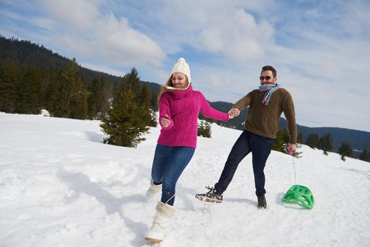 romantic winter  scene, happy young couple having fun on fresh show on winter vacatio, mountain nature landscape