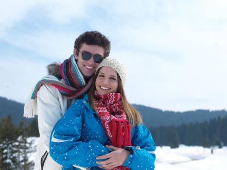 portrait of happy young romantic tourist  couple outdoor in nature at winter vacation