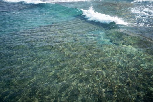 Sea water makin beautiful waves under sun