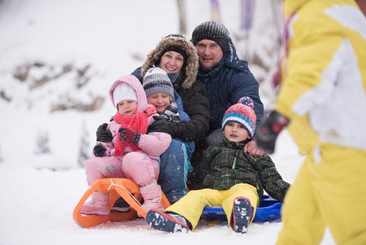 group of children having fun and play together in fresh snow on winter vacation