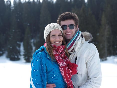 portrait of happy young romantic tourist  couple outdoor in nature at winter vacation