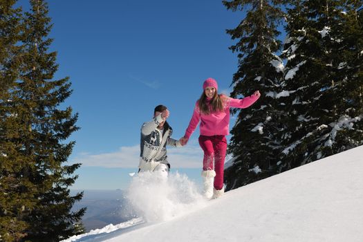 Young Couple In winter Snow Scene at  beautiful sunny day