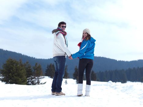 portrait of happy young romantic tourist  couple outdoor in nature at winter vacation