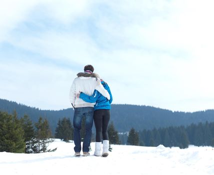 portrait of happy young romantic tourist  couple outdoor in nature at winter vacation