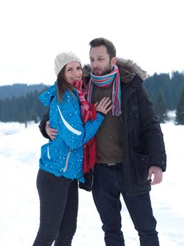 portrait of happy young romantic tourist  couple outdoor in nature at winter vacation