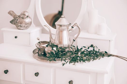 coffee service and olive branch on the table in the boudoir.photo with copy space