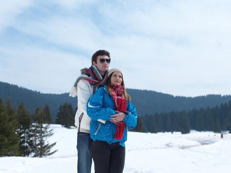 portrait of happy young romantic tourist  couple outdoor in nature at winter vacation