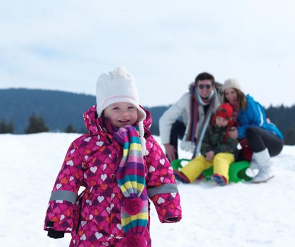 Winter playing, fun, snow and family portrait  sledding at winter time