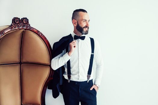elegant man with a jacket over his shoulder. photo with copy space