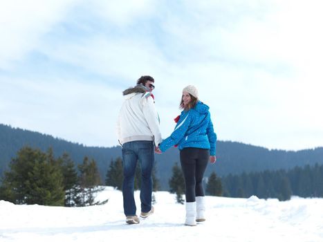 portrait of happy young romantic tourist  couple outdoor in nature at winter vacation